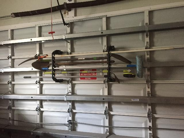 garage door storage rack for yard tools