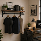 Clothes rail and shelf in a home office holding shirts and a jacket below books