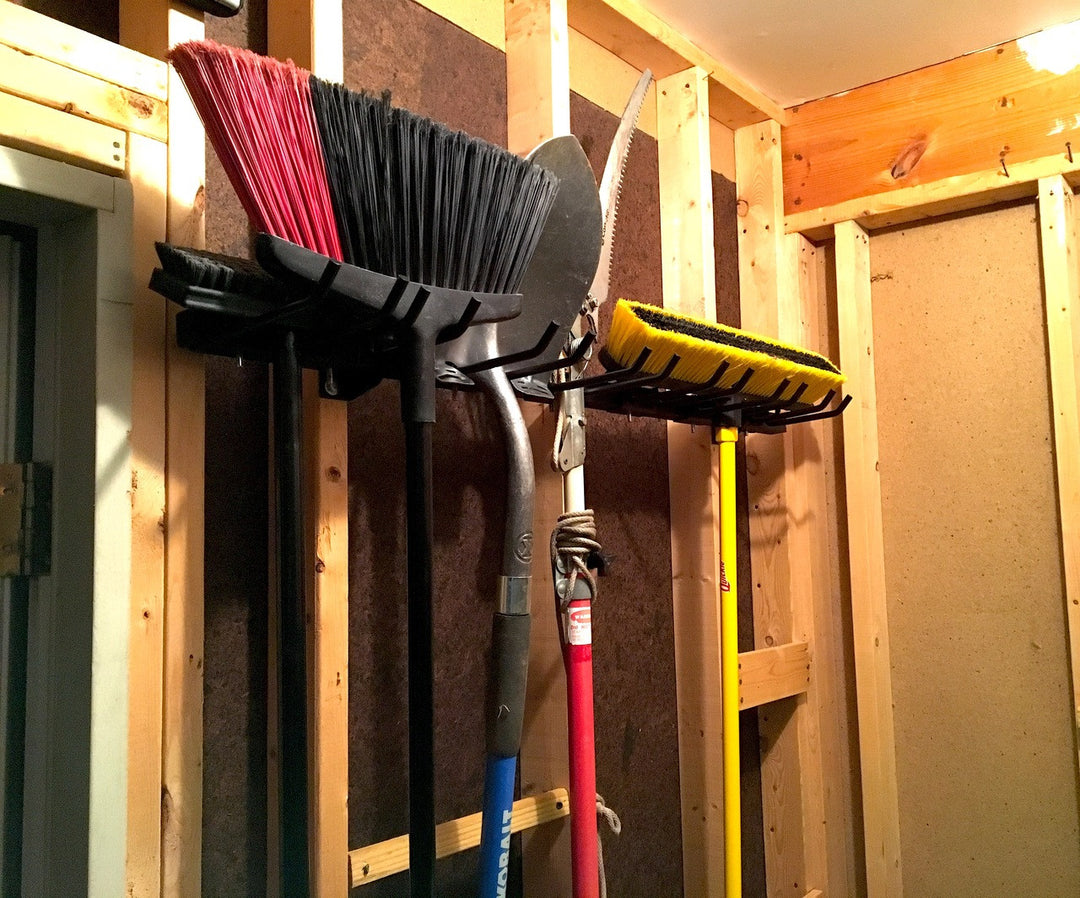 broom and shovel wall storage rack