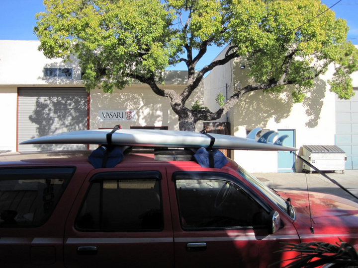 Surfboard transport with inflatable roof rack