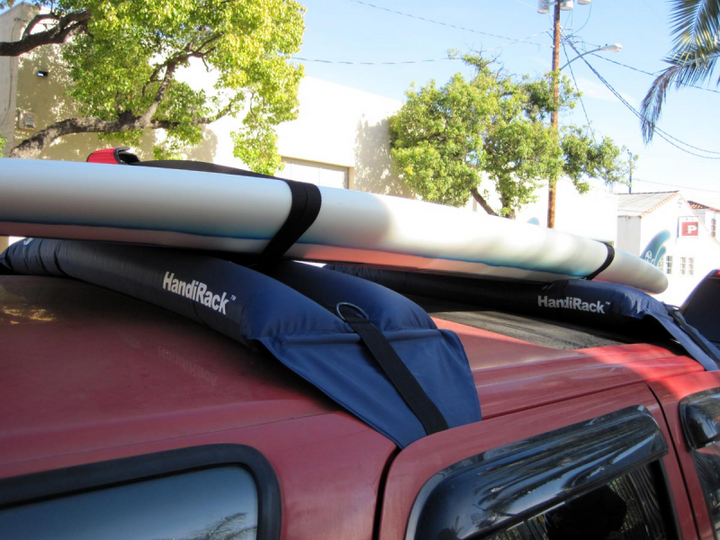 Soft and inflatable roof rack system for carrying stand up paddleboards