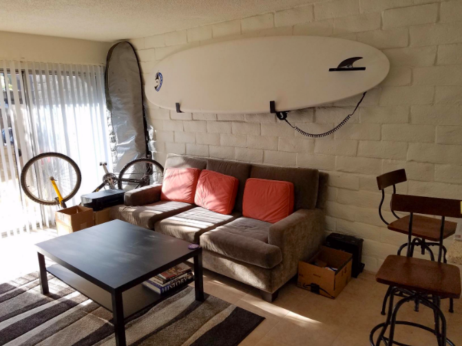 minimalist paddleboard display rack for living rooms