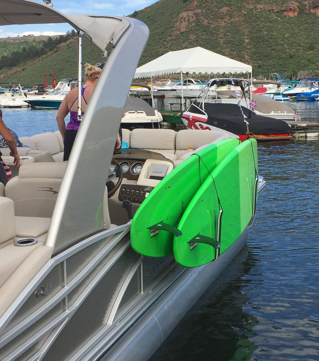 paddleboard storage rack on pontoon boat