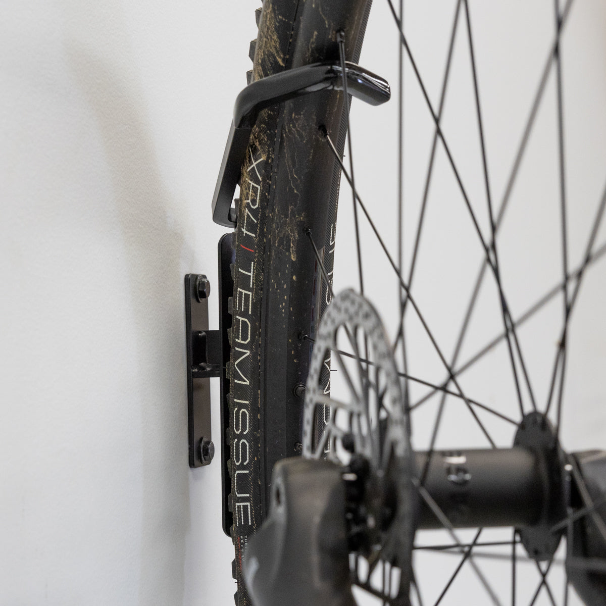 bike storage hook holds bicycle wheel